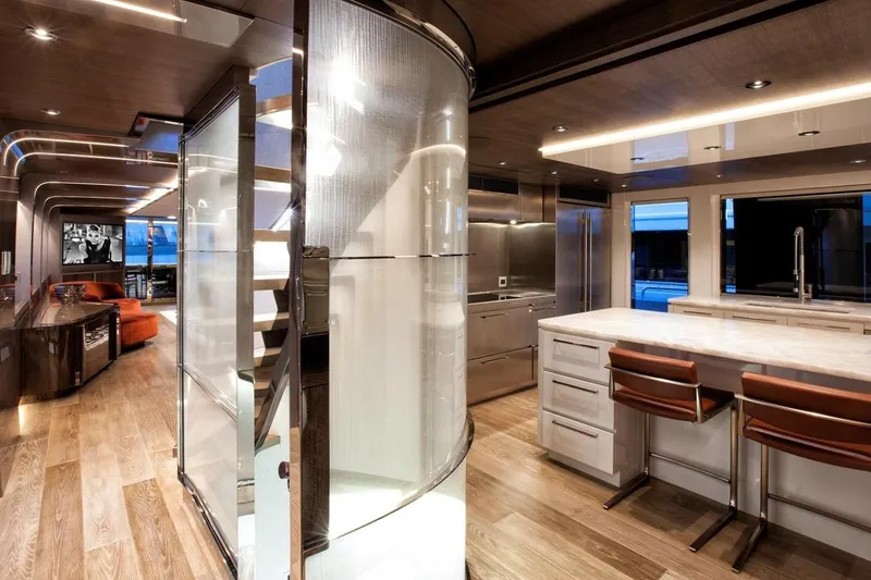 Slide: The Image of Luxurious 2018 Westport Raised Pilothouse yacht interior with open wine cooler. - 11