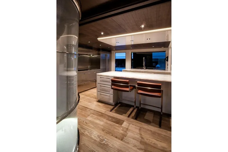 Slide: The Image of Luxurious 2018 Westport Raised Pilothouse yacht kitchen with modern design and waterfront view. - 13