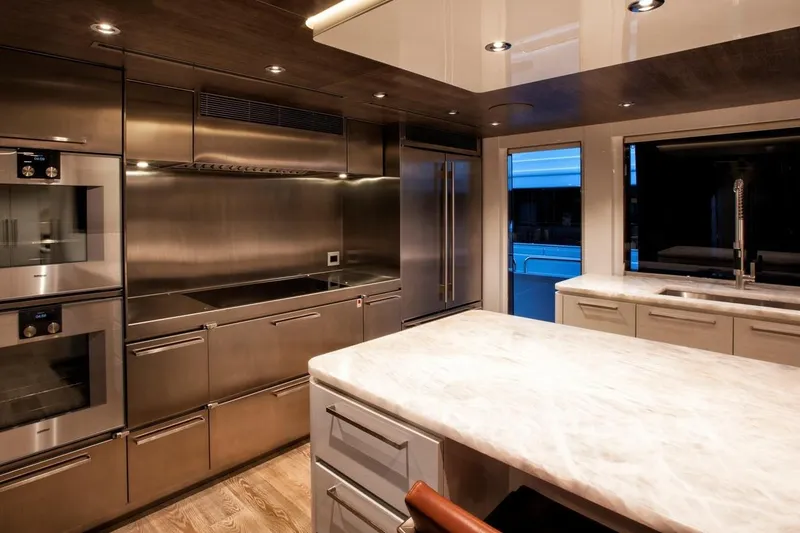 Slide: The Image of Luxurious bedroom interior on 2018 Westport Raised Pilothouse yacht, featuring elegant decor and city view. - 14