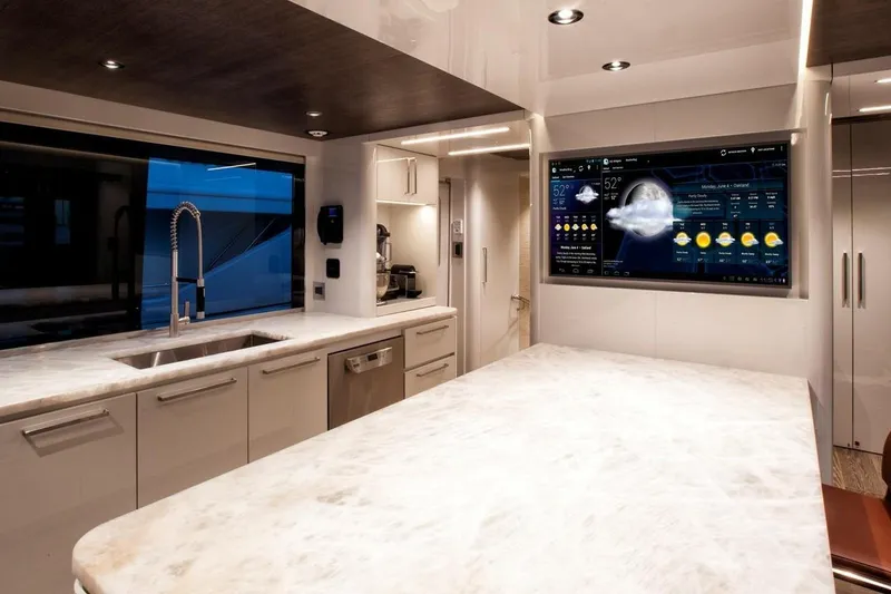 Slide: The Image of Luxurious bedroom interior on 2018 Westport Raised Pilothouse yacht, featuring elegant decor and ocean view. - 16