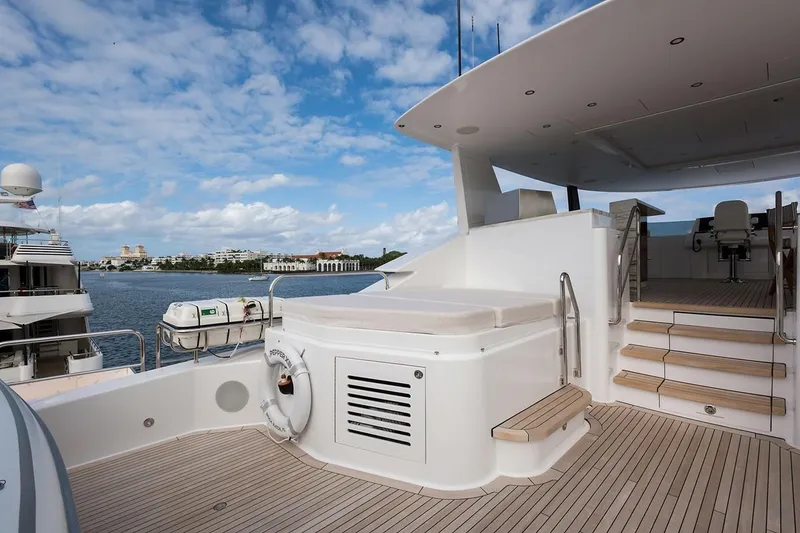 Slide: The Image of Luxurious 2018 Westport Raised Pilothouse yacht deck with sun loungers and jacuzzi. - 43
