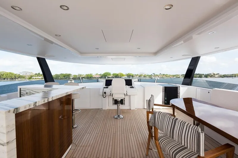 Slide: The Image of 2018 Westport Raised Pilothouse yacht deck with ocean view and sleek design. - 45