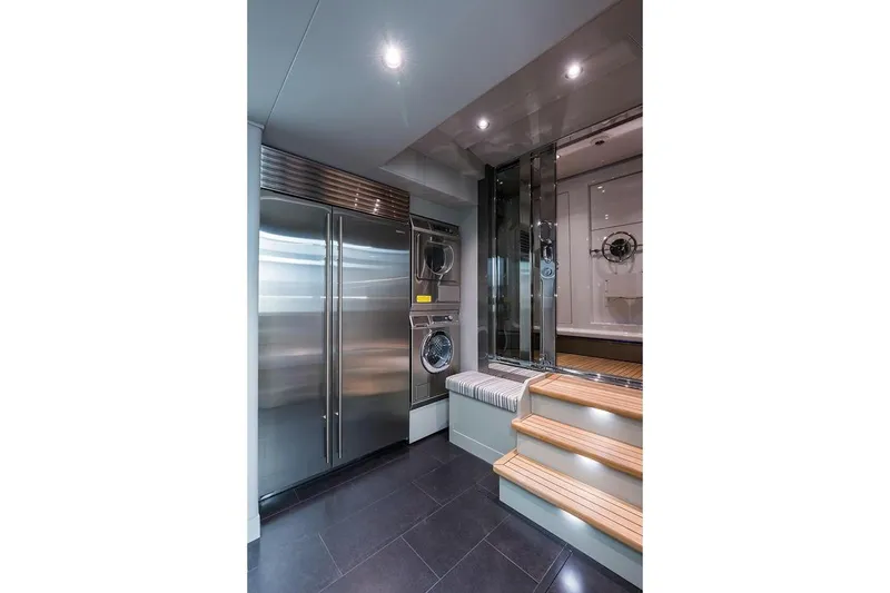 Slide: The Image of Luxurious 2018 Westport Raised Pilothouse yacht deck with sunshade and scenic waterfront view. - 49