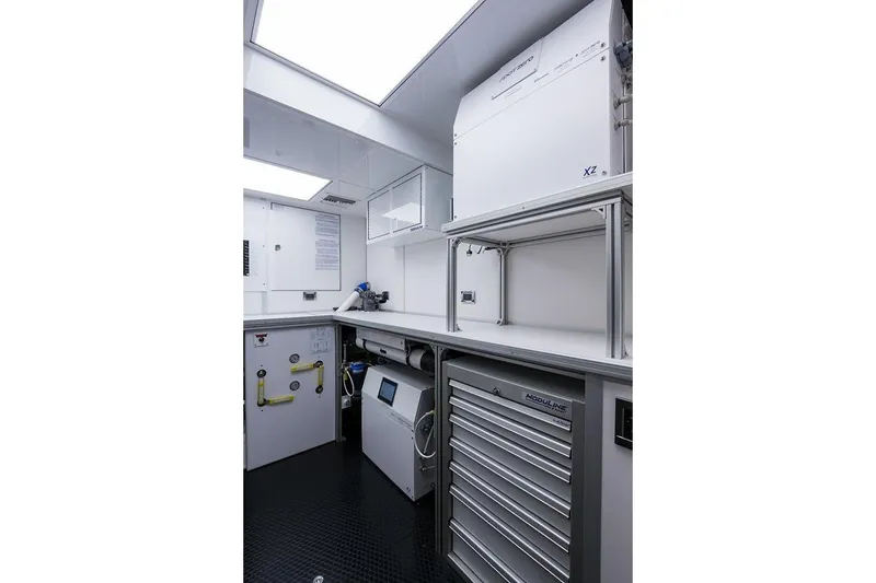 Slide: The Image of Luxurious 2018 Westport Raised Pilothouse yacht deck with elegant dining area and ocean view. - 52