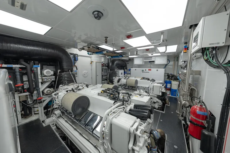 Slide: The Image of Workshop area inside 2018 Westport Raised Pilothouse yacht, featuring tools and storage cabinets. - 56