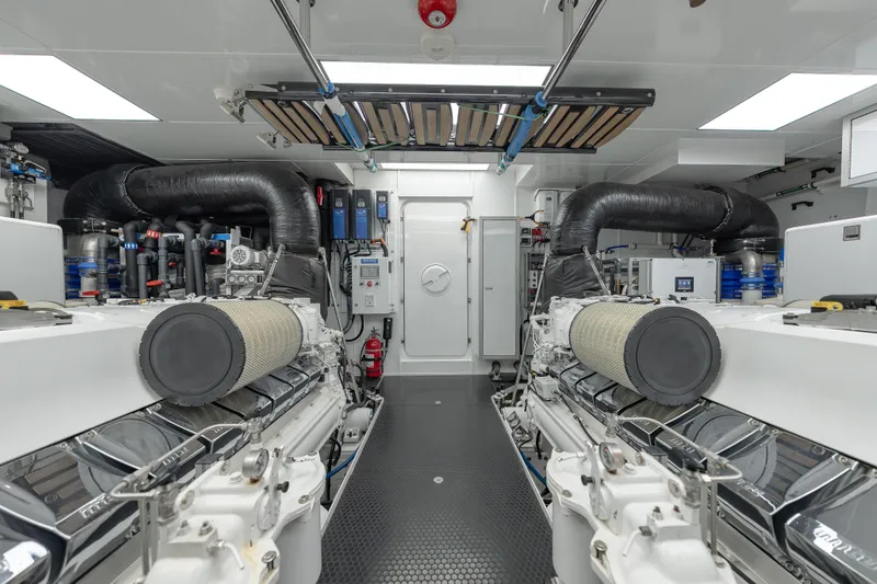 Slide: The Image of Engine room of 2018 Westport Raised Pilothouse yacht, featuring dual engines and modern equipment. - 57