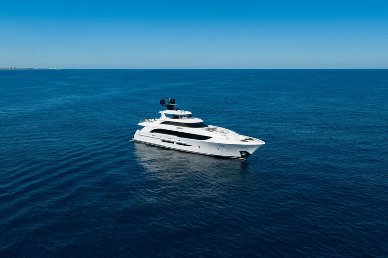 Slide: The Image of Luxury 2018 Westport Raised Pilothouse yacht cruising on open sea. - 63