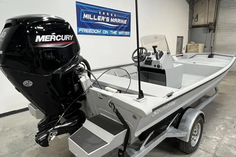 Slide: The Image of 2025 SeaArk 1860 MVJT boat with Mercury engine in showroom. - 4