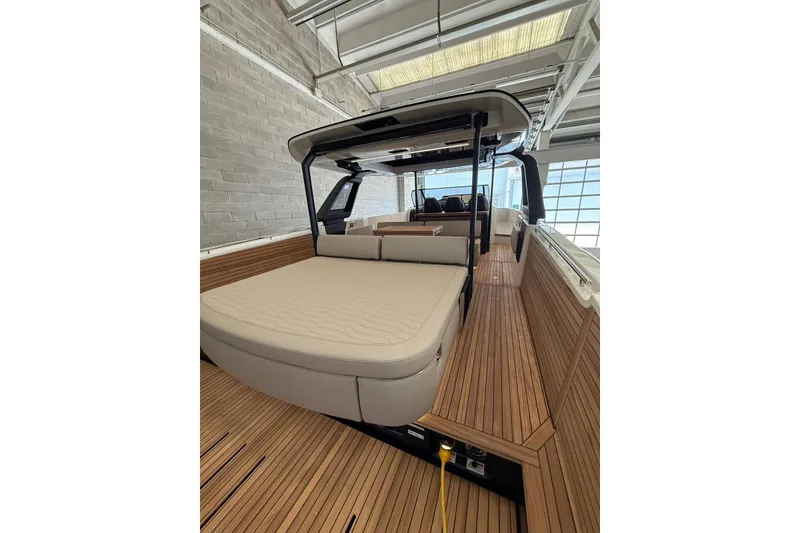 Slide: The Image of 2026 Cranchi A46 Luxury Tender with elegant teak decking and spacious seating area. - 12