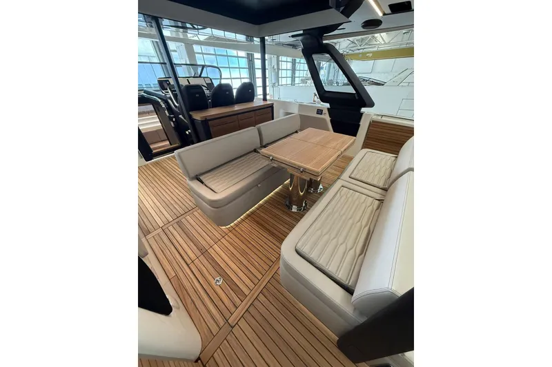 Slide: The Image of Luxurious interior of 2026 Cranchi A46 Luxury Tender with elegant seating and wooden flooring. - 13