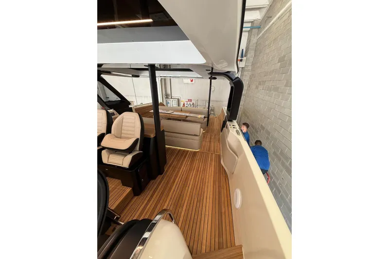 Slide: The Image of 2026 Cranchi A46 Luxury Tender interior with elegant seating and wooden flooring. - 18