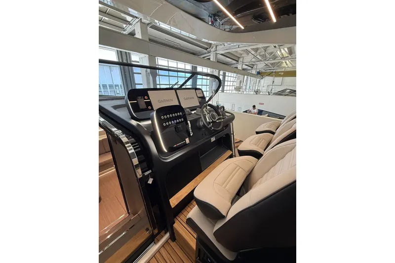 Slide: The Image of Interior of 2026 Cranchi A46 Luxury Tender with modern helm and seating. - 24