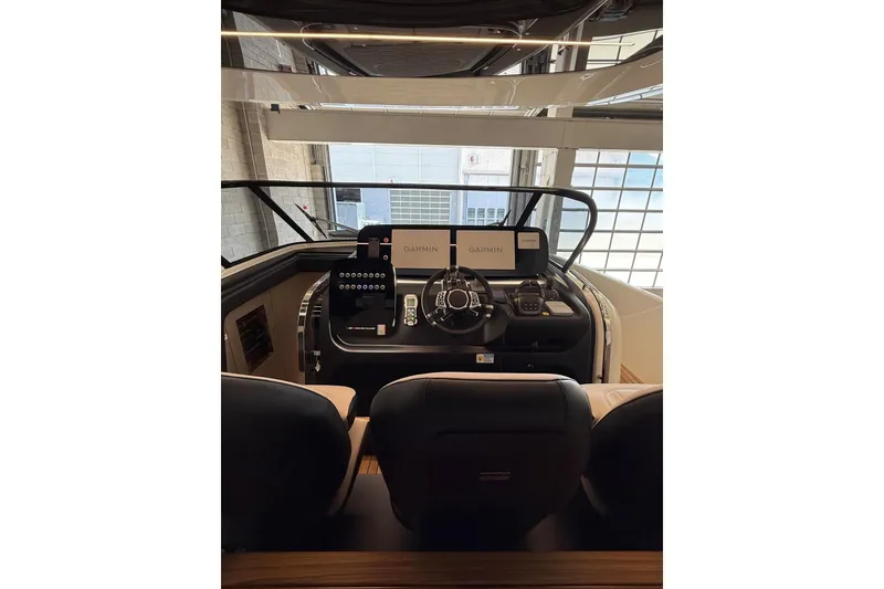 Slide: The Image of Interior cockpit of 2026 Cranchi A46 Luxury Tender with Garmin navigation system. - 25