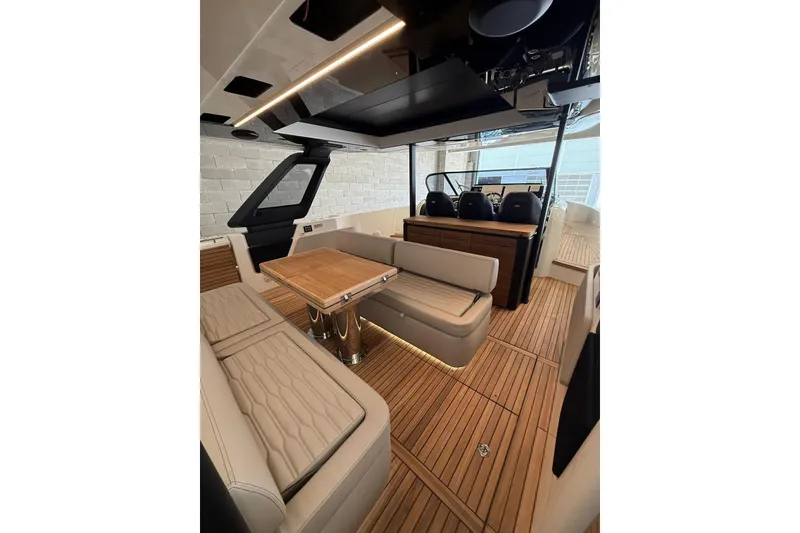 Slide: The Image of 2026 Cranchi A46 Luxury Tender interior with elegant seating and wooden flooring. - 26