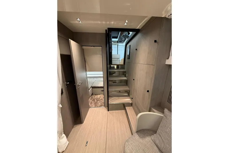 Slide: The Image of Interior of 2026 Cranchi A46 Luxury Tender, featuring modern design and wooden finishes. - 27
