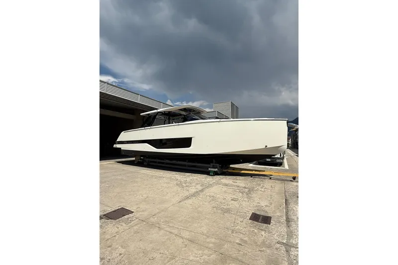 Slide: The Image of 2026 Cranchi A46 Luxury Tender yacht on a concrete surface under cloudy sky. - 28