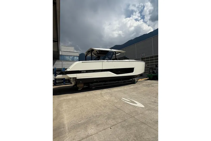 Slide: The Image of 2026 Cranchi A46 Luxury Tender yacht on display outdoors. - 7