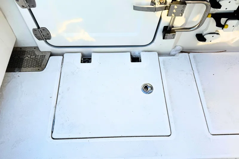 Slide: The Image of 2023 Solace 32 CS boat ladder compartment with stainless steel hardware. - 12