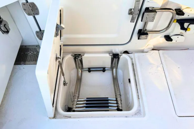 Slide: The Image of 2023 Solace 32 CS boat interior detail with stainless steel hinge and latch. - 13