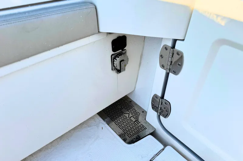 Slide: The Image of 2023 Solace 32 CS boat interior with cushioned seating and ocean view. - 14