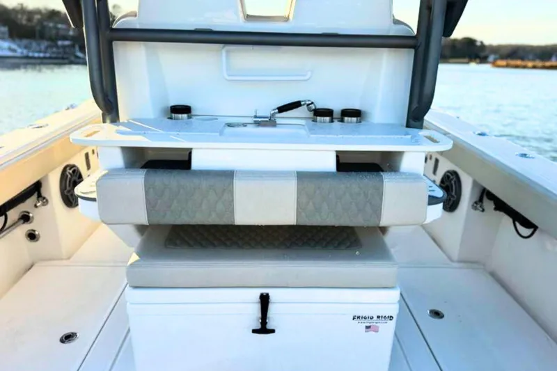 Slide: The Image of 2023 Solace 32 CS boat interior with sink, cutting boards, and cup holders. - 23