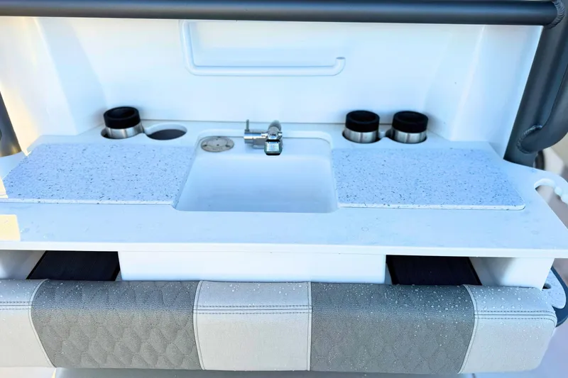 Slide: The Image of 2023 Solace 32 CS boat with speakers and rod holders on the deck. - 25