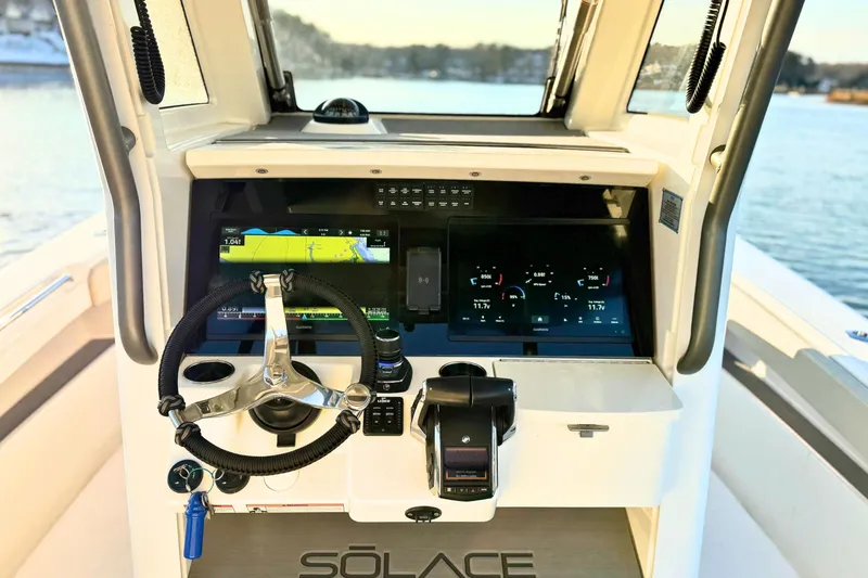 Slide: The Image of Garmin GPS display on 2023 Solace 32 CS boat, showing navigation map and speed. - 31
