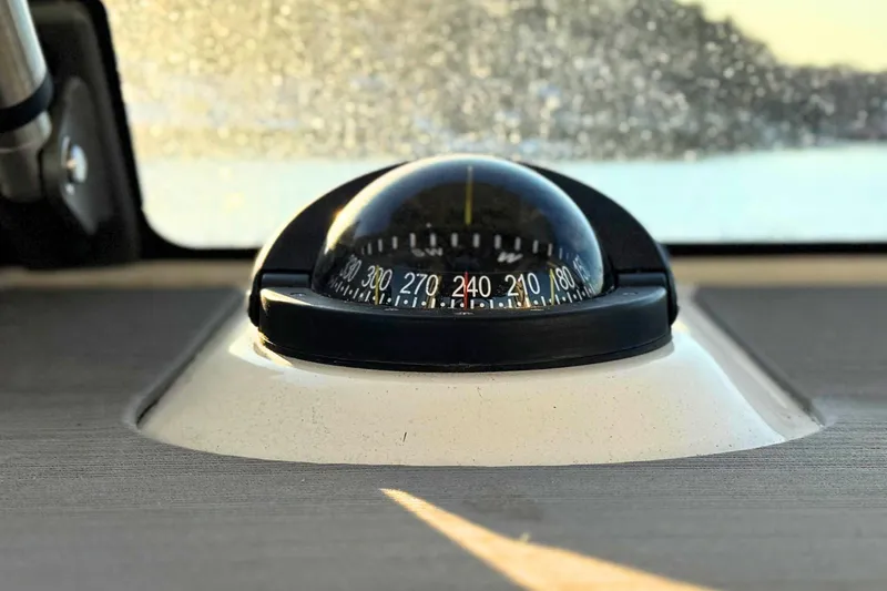 Slide: The Image of Control panel of 2023 Solace 32 CS boat with navigation and lighting switches. - 32