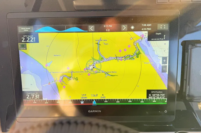 Slide: The Image of 2023 Solace 32 CS dashboard display with various engine metrics and GPS speed. - 33