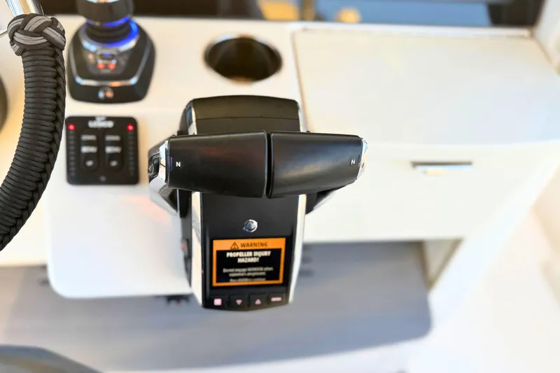 Slide: The Image of 2023 Solace 32 CS dashboard with open storage compartment and digital displays. - 37