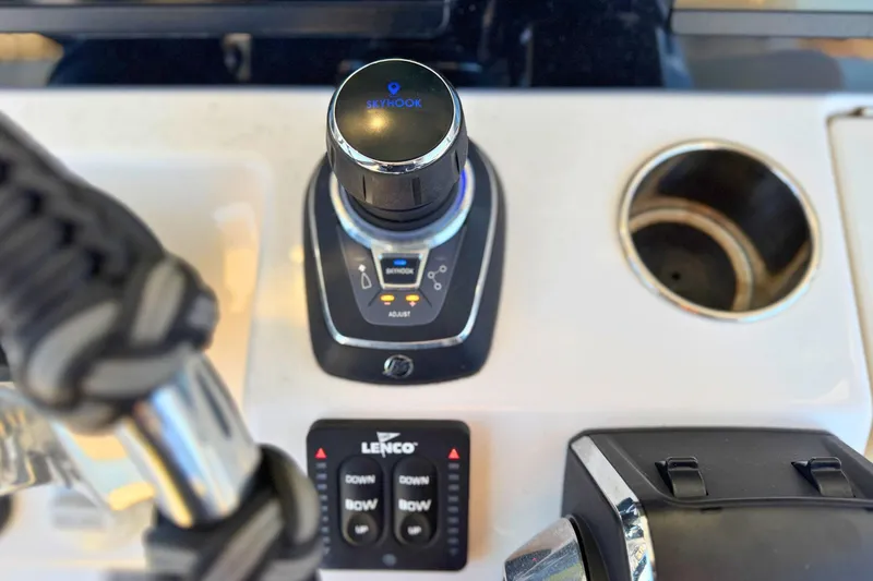 Slide: The Image of 2023 Solace 32 CS boat dashboard with Icom radios and JL Audio system. - 38