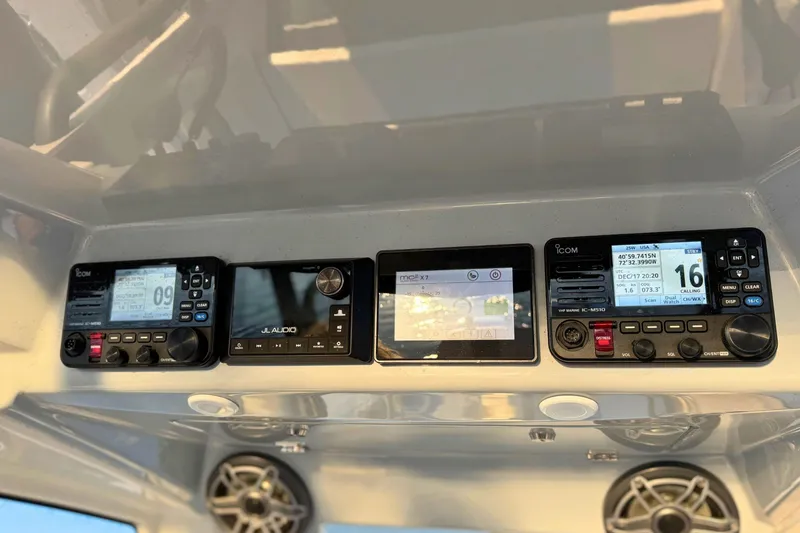 Slide: The Image of Interior of 2023 Solace 32 CS boat with communication equipment and speaker. - 40