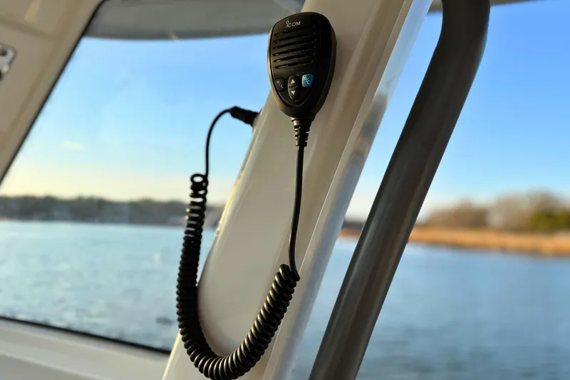 Slide: The Image of 2023 Solace 32 CS boat dashboard with controls and logo. - 42