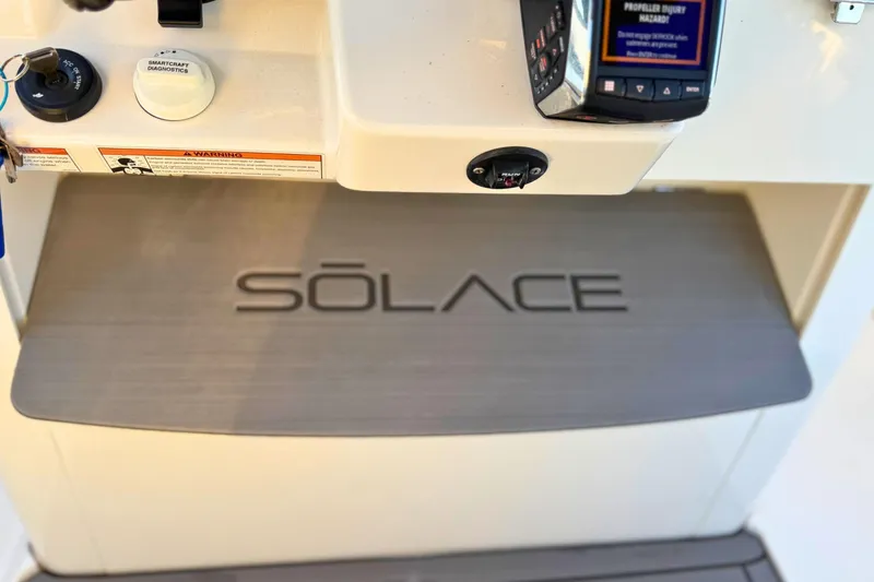 Slide: The Image of 2023 Solace 32 CS boat interior detail with storage compartment. - 44