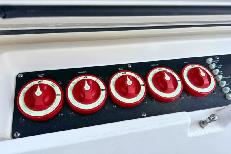 Slide: The Image of Storage compartment on 2023 Solace 32 CS boat with safety equipment and signal horn. - 45