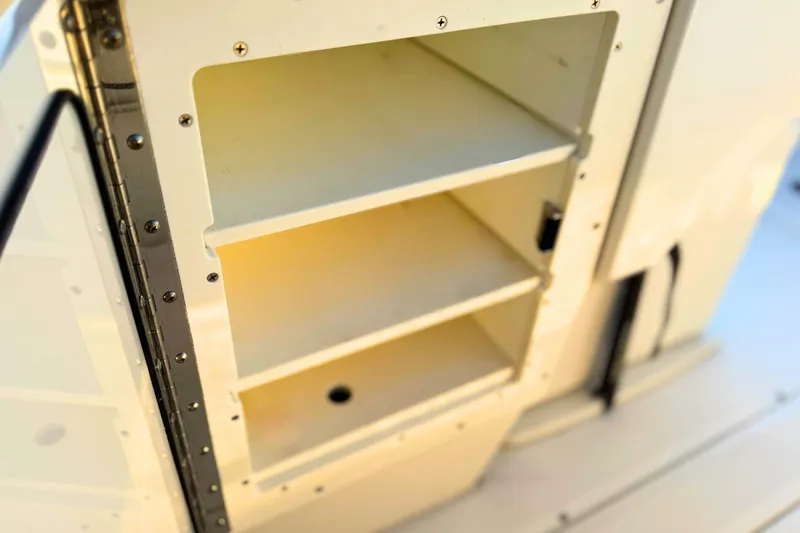 Slide: The Image of Interior of 2023 Solace 32 CS boat, featuring seating and speaker system. - 49