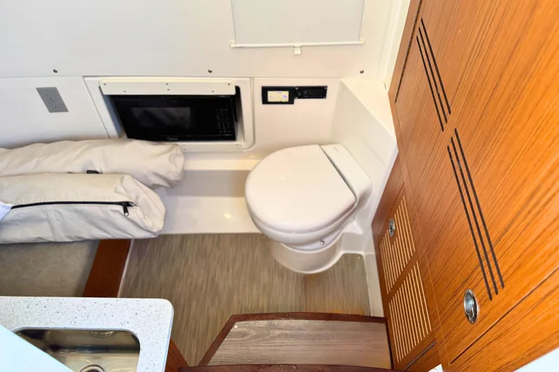 Slide: The Image of Electrical system setup in a 2023 Solace 32 CS boat, featuring Xantrex and NOCO Genius components. - 55