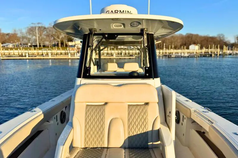 Slide: The Image of Twin Mercury FourStroke engines on a 2023 Solace 32 CS boat, floating on water. - 62