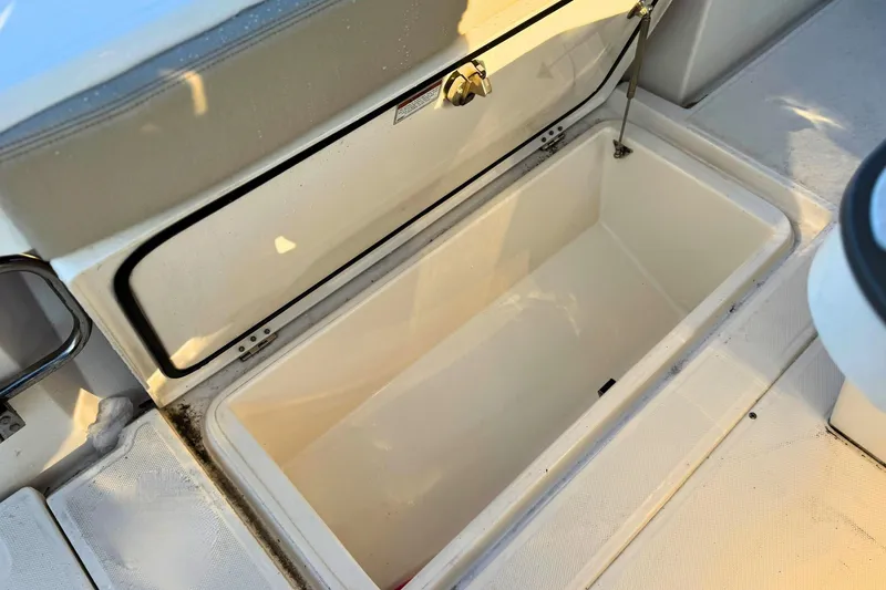 Slide: The Image of 2023 Solace 32 CS boat engine compartment with seacocks and battery system. - 63