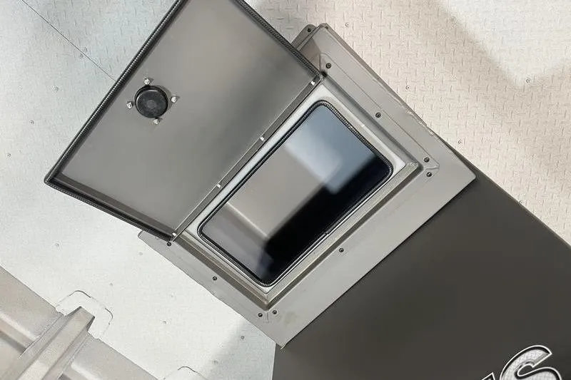 Slide: The Image of Open storage compartment on 2025 SeaArk 2472 CUB boat, featuring durable construction. - 11