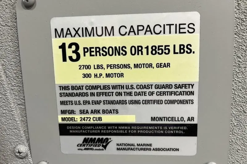 Slide: The Image of Capacity label for 2025 SeaArk 2472 CUB, 13 persons or 1855 lbs, 300 HP motor. - 16