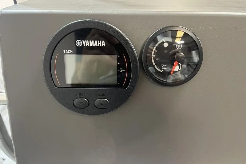 Slide: The Image of Yamaha tachometer and gauge on 2025 SeaArk 2472 CUB boat dashboard. - 9