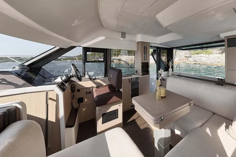 Slide: The Image of Manufacturer Provided Image: Luxurious interior of 2026 Prestige F4.3 yacht with modern seating and scenic ocean view. - 8