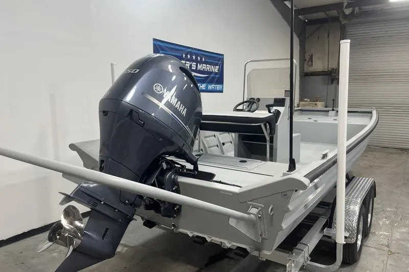 Slide: The Image of 2025 SeaArk 2072 CUB boat with Yamaha outboard motor in a garage setting. - 3