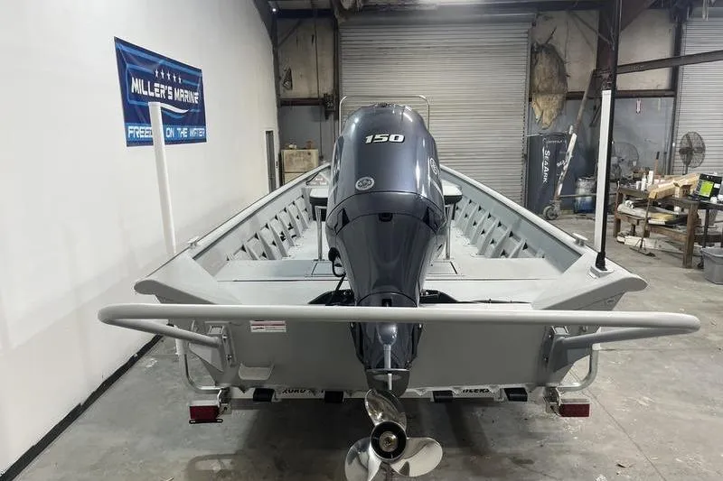 Slide: The Image of 2025 SeaArk 2072 CUB boat with 150 HP engine in a garage setting. - 4