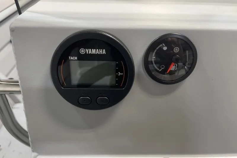 Slide: The Image of Yamaha tachometer and fuel gauge on 2025 SeaArk 2072 CUB boat dashboard. - 7