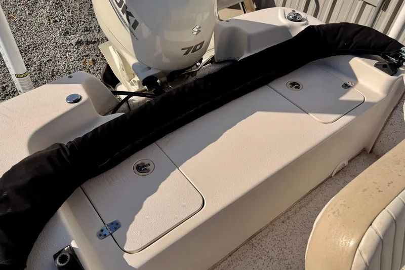 Slide: The Image of 2018 Carolina Skiff 18 JVX CC boat with Suzuki 70 engine, rear deck view. - 2