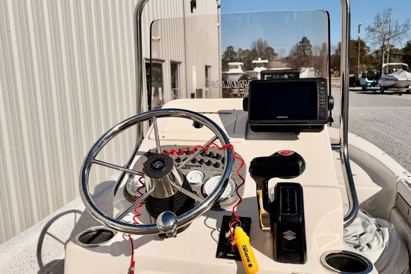 Slide: The Image of 2018 Carolina Skiff 18 JVX CC boat console with steering wheel and Garmin GPS. - 3