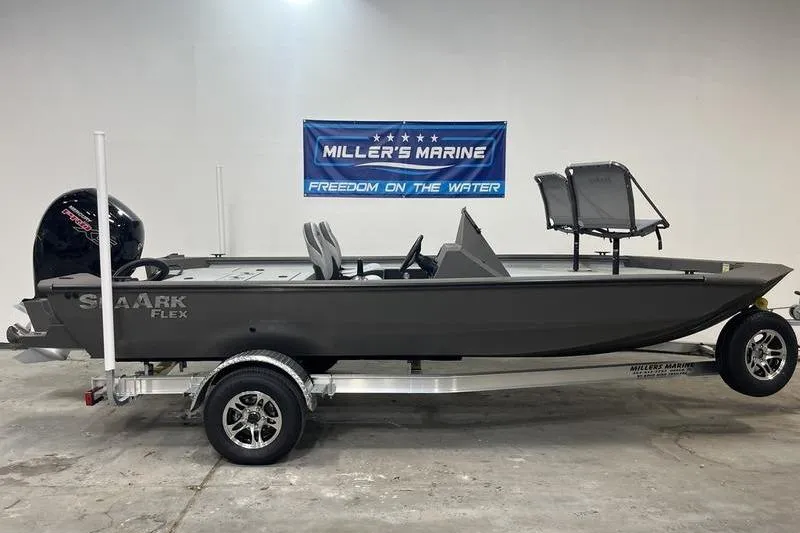 The Image of 2026 SeaArk Flex 19 Pro boat on trailer at Miller's Marine showroom. - 0