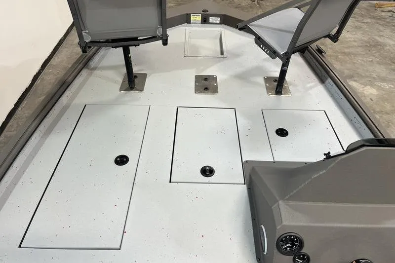 Slide: The Image of 2026 SeaArk Flex 19 Pro boat interior with seating and storage compartments. - 15